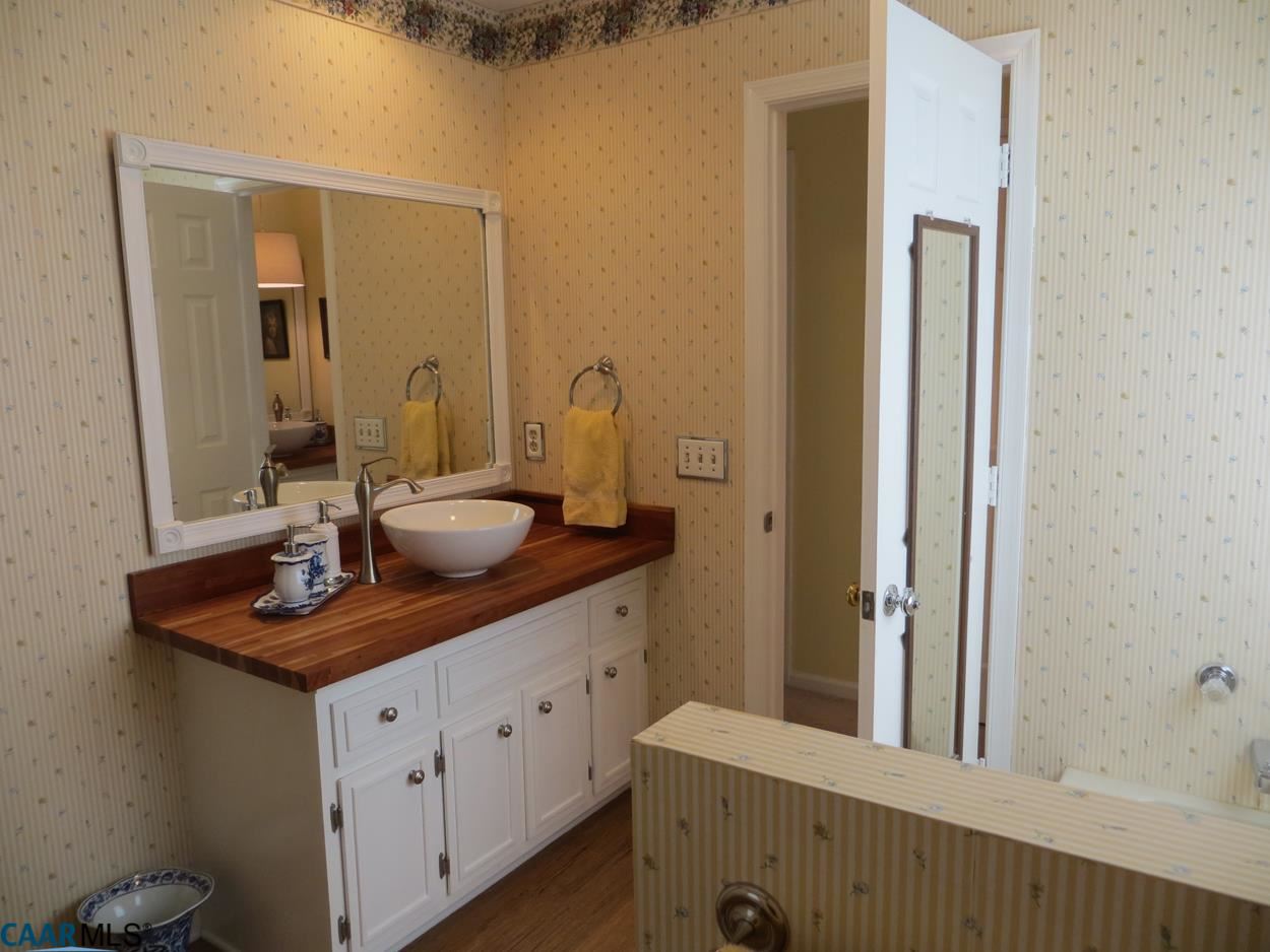 315 Grassmere Road Charlottesville, VA 22903 - Photo 15 of 32 a bathroom with a sink and a mirror
