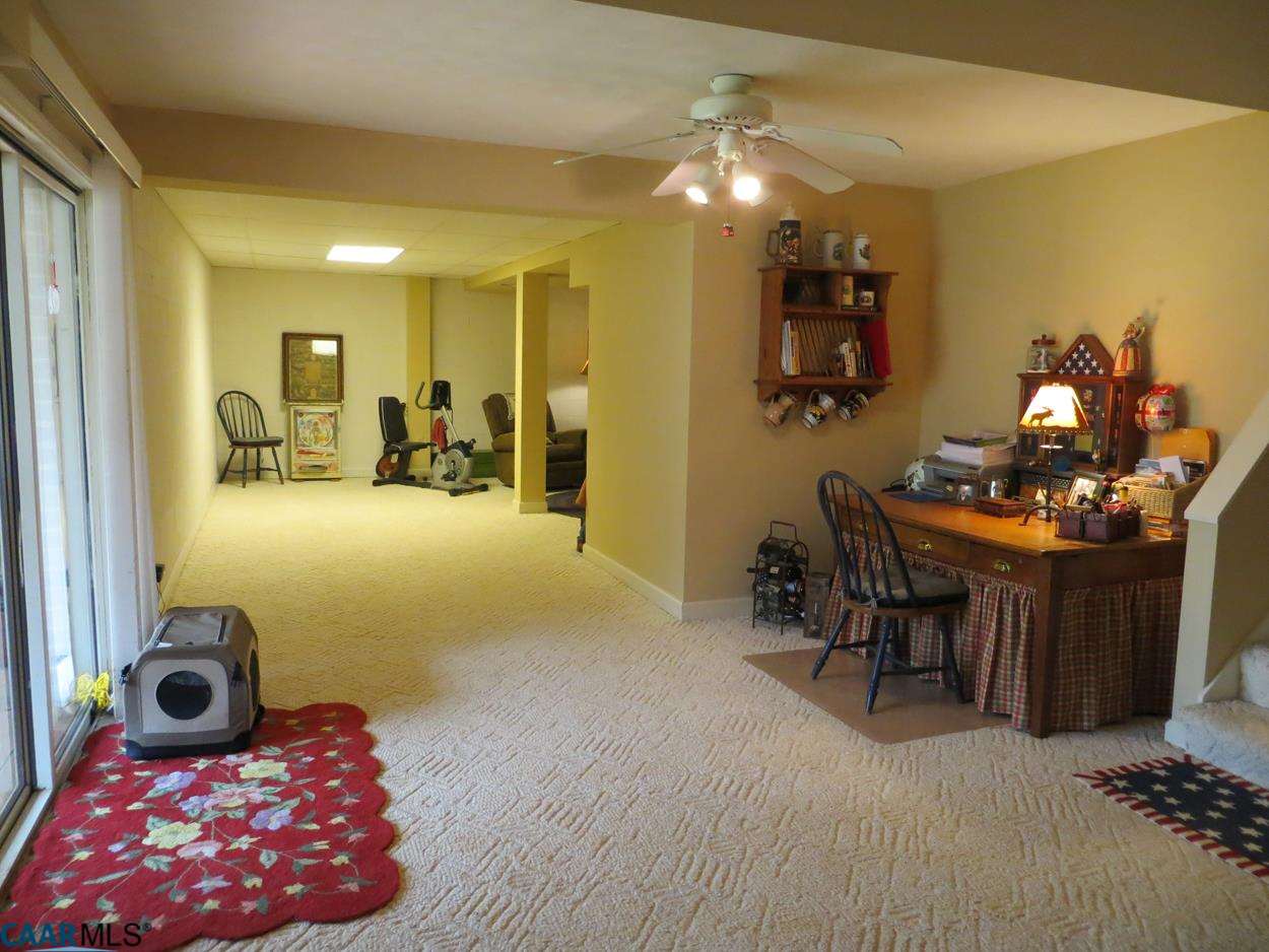 315 Grassmere Road Charlottesville, VA 22903 - Photo 23 of 32 a living room with furniture and wooden floor