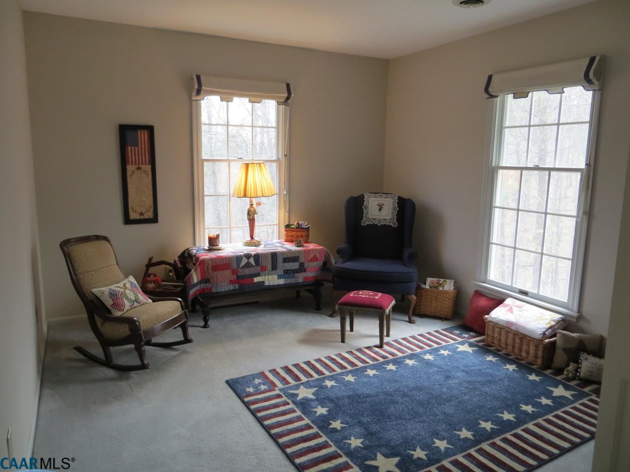 315 Grassmere Road Charlottesville, VA 22903 - Photo 5 of 32 a living room with furniture a rug and a window