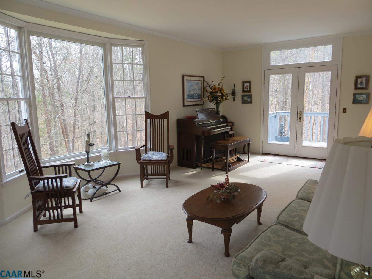 315 Grassmere Road Charlottesville, VA 22903 - Photo 6 of 32 a living room with furniture a table and large windows
