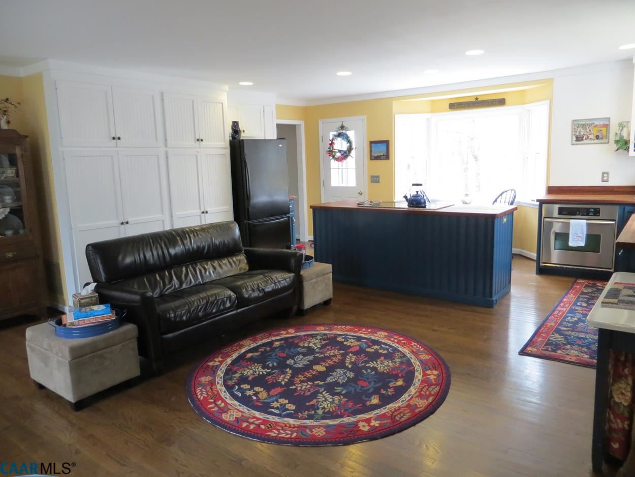315 Grassmere Road Charlottesville, VA 22903 - Photo 10 of 32 a living room with furniture and a fireplace