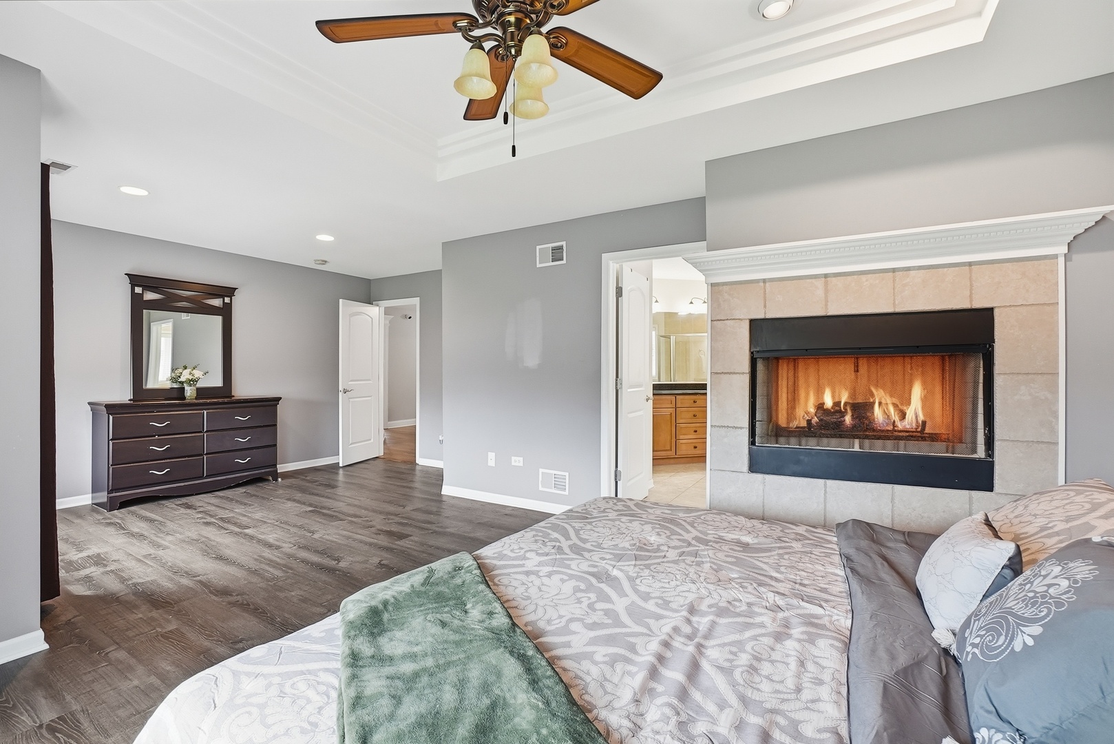 S635 Robbins Street Winfield, IL 60190 - Photo 12 of 35 a bed room with a bed and a fireplace