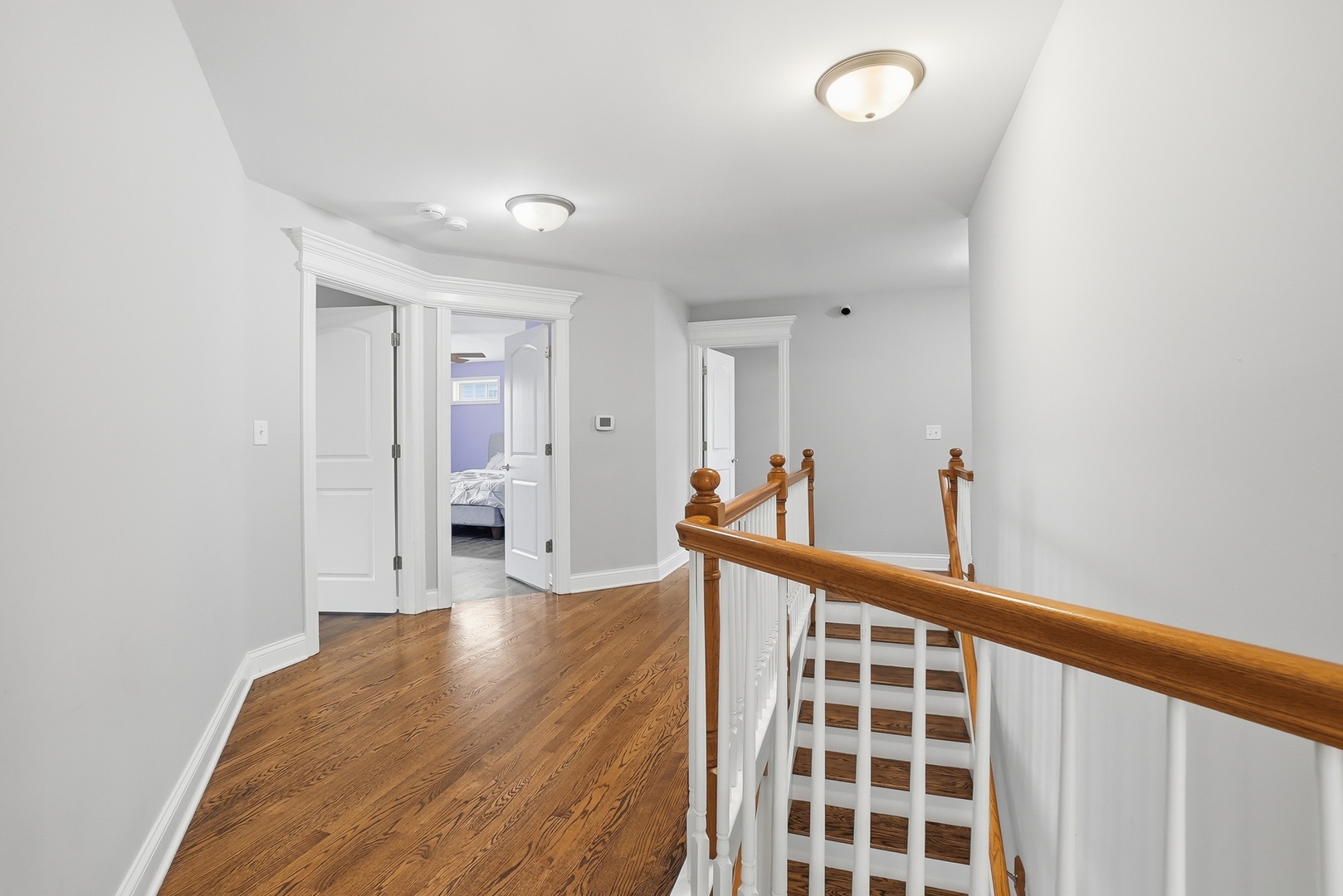 S635 Robbins Street Winfield, IL 60190 - Photo 15 of 35 a view of a big room with wooden floor and windows