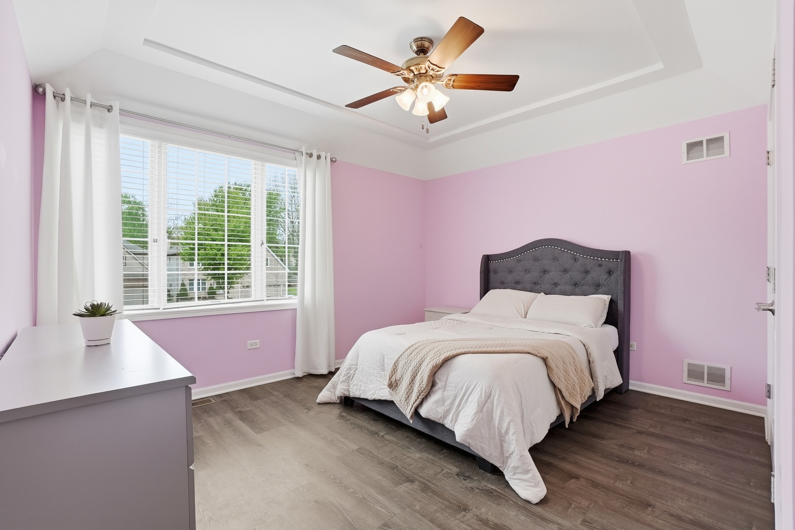 S635 Robbins Street Winfield, IL 60190 - Photo 16 of 35 a bedroom with a bed and a large window with wooden floor