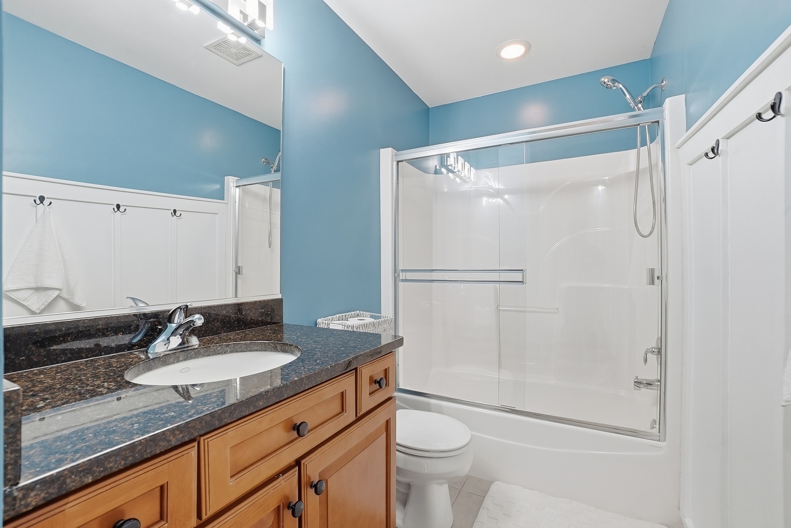 S635 Robbins Street Winfield, IL 60190 - Photo 19 of 35 a bathroom with a granite countertop sink toilet and shower