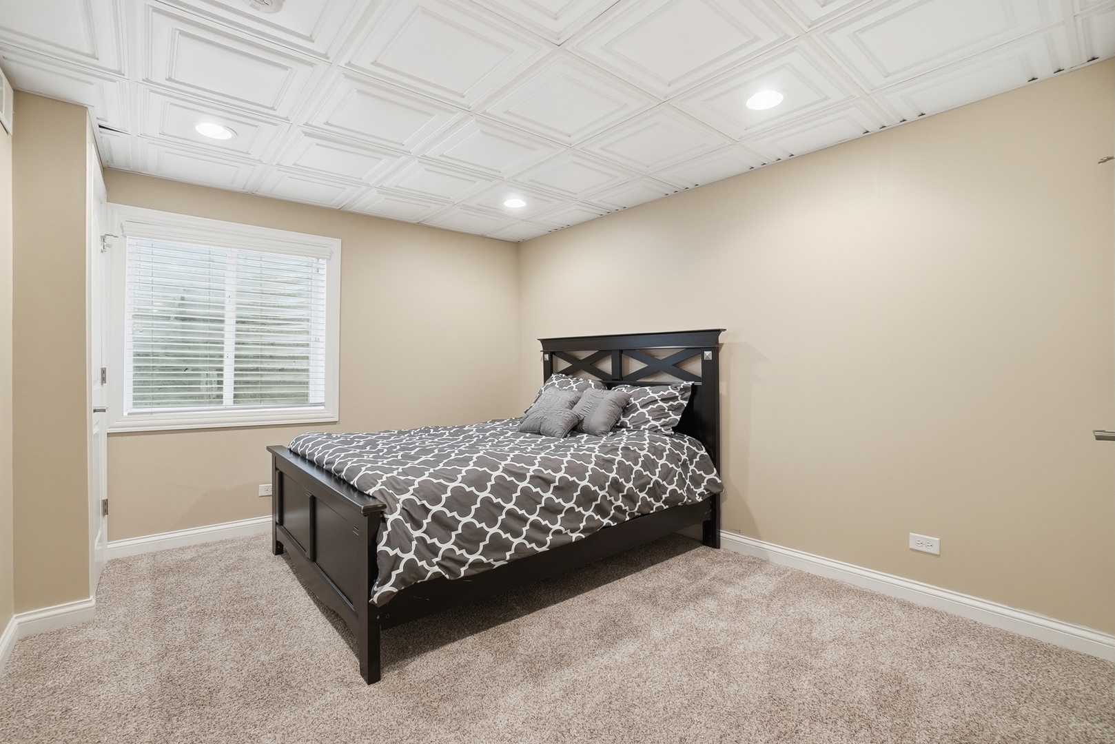 S635 Robbins Street Winfield, IL 60190 - Photo 22 of 35 a bed sitting in a room next to a window