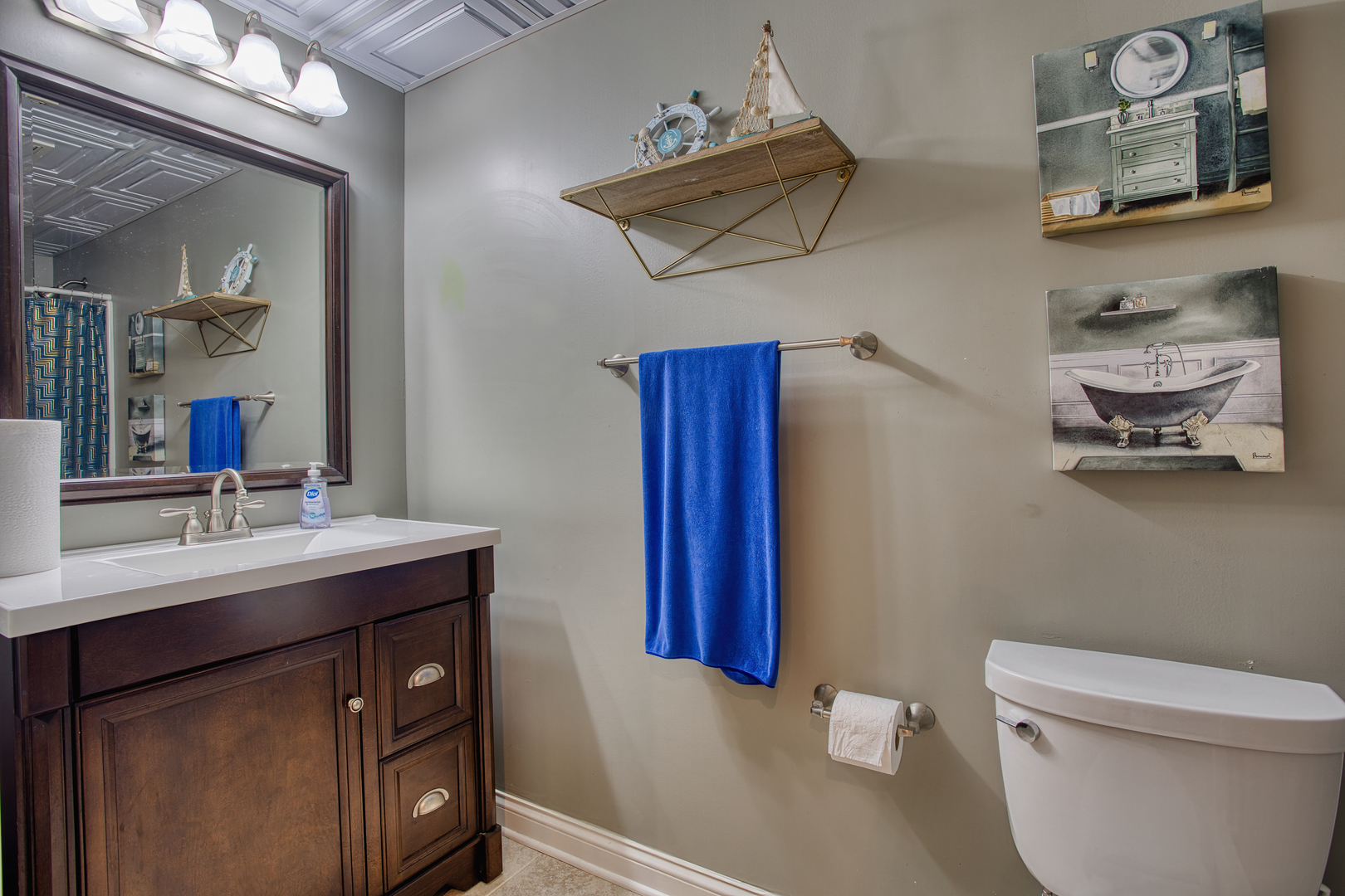 S635 Robbins Street Winfield, IL 60190 - Photo 23 of 35 a bathroom with a sink a toilet and mirror