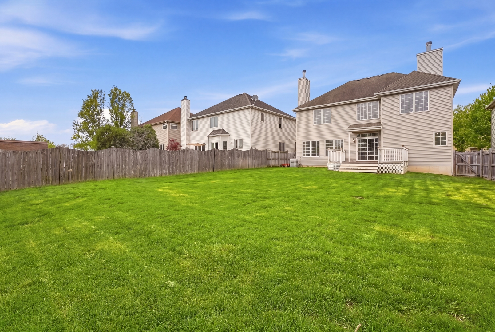 S635 Robbins Street Winfield, IL 60190 - Photo 26 of 35 a front view of house with yard and green space
