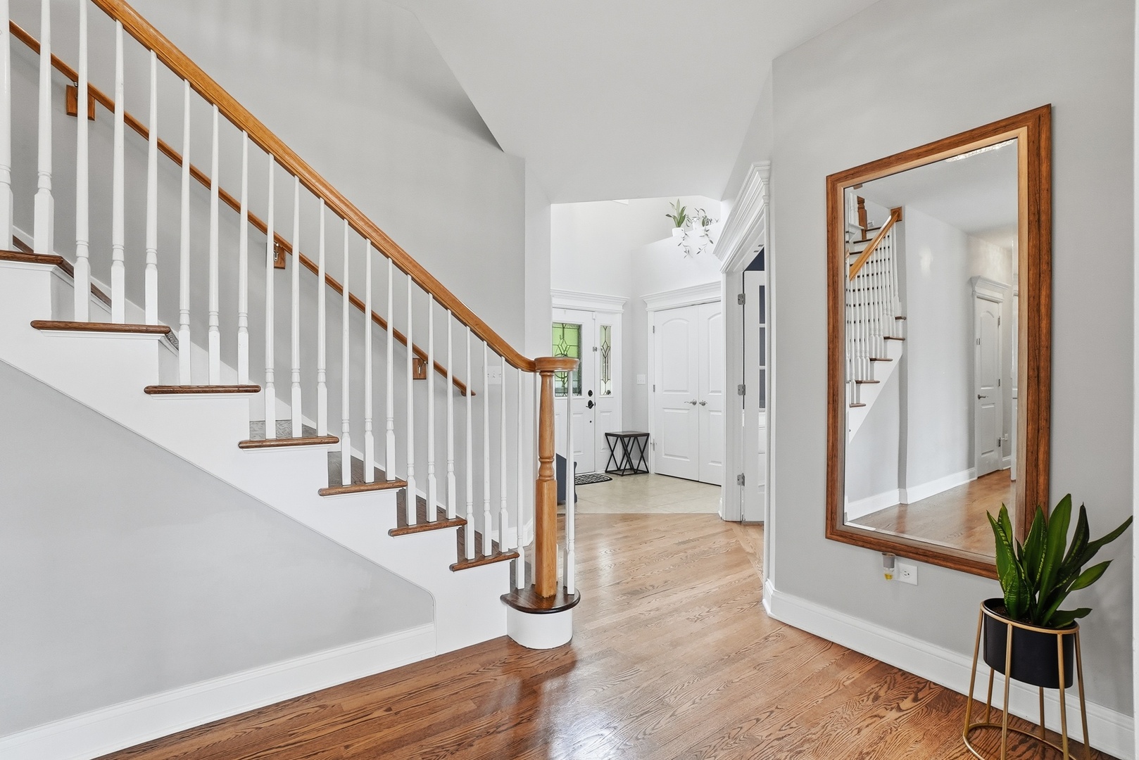 S635 Robbins Street Winfield, IL 60190 - Photo 3 of 35 a view of entryway with wooden floor and stairs