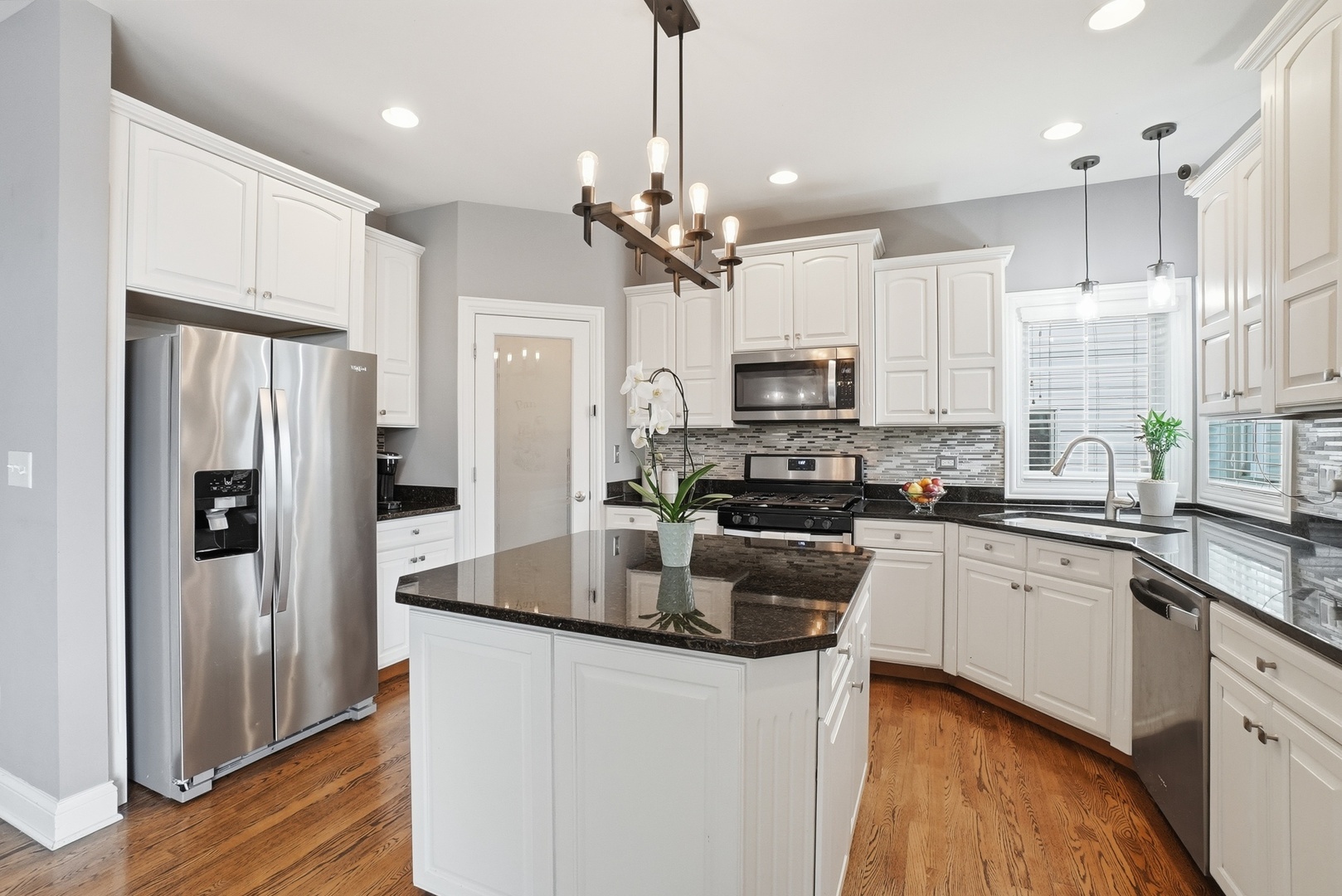 S635 Robbins Street Winfield, IL 60190 - Photo 5 of 35 a kitchen with stainless steel appliances a refrigerator sink and microwave
