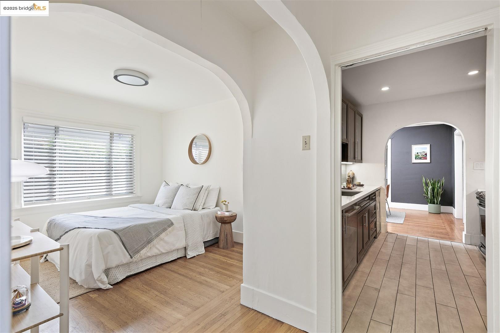 2201-2203 Spaulding Avenue Berkeley, CA 94703 - Photo 17 of 56 Bedroom featuring light wood finished floors, arched walkways, and recessed lighting