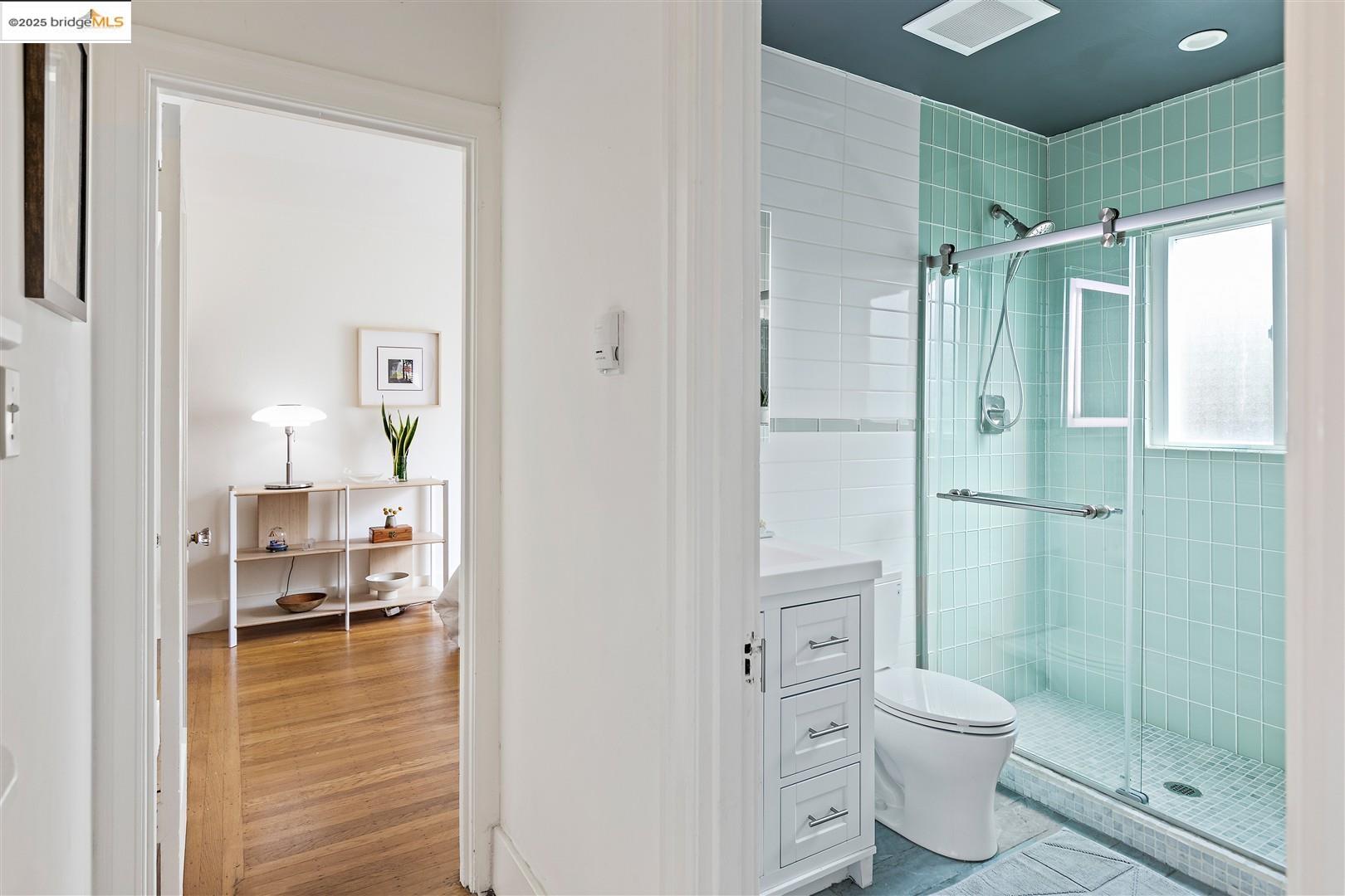 2201-2203 Spaulding Avenue Berkeley, CA 94703 - Photo 18 of 56 Bathroom with a shower stall, vanity, and light wood-style floors