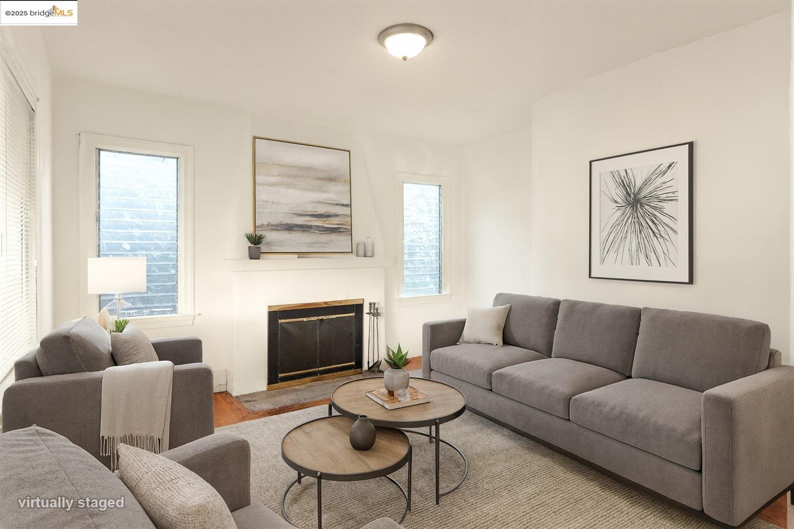 2201-2203 Spaulding Avenue Berkeley, CA 94703 - Photo 36 of 56 Living room featuring a glass covered fireplace and wood finished floors