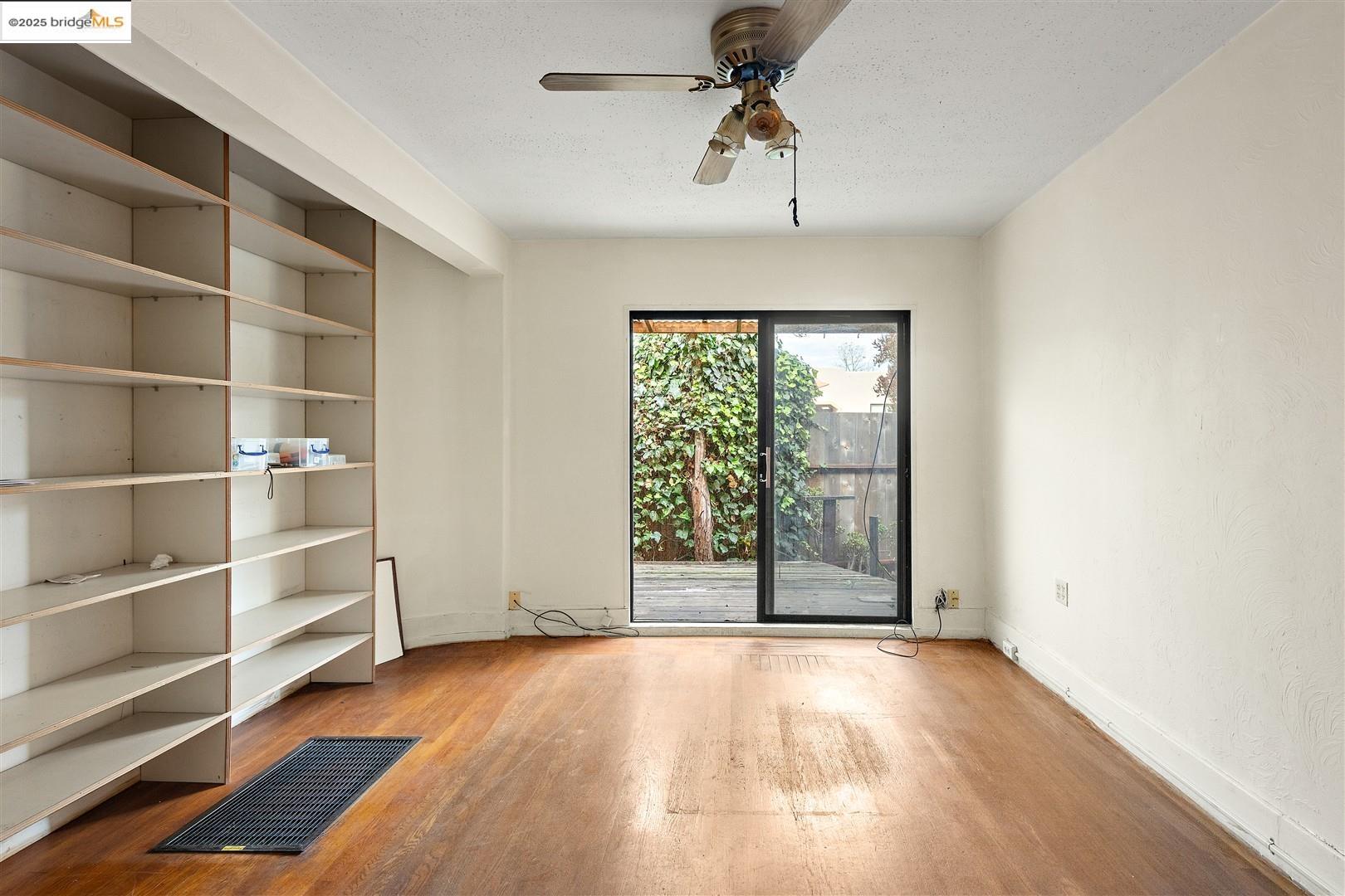 2201-2203 Spaulding Avenue Berkeley, CA 94703 - Photo 43 of 56 Spare room with wood finished floors, ceiling fan, and a textured ceiling