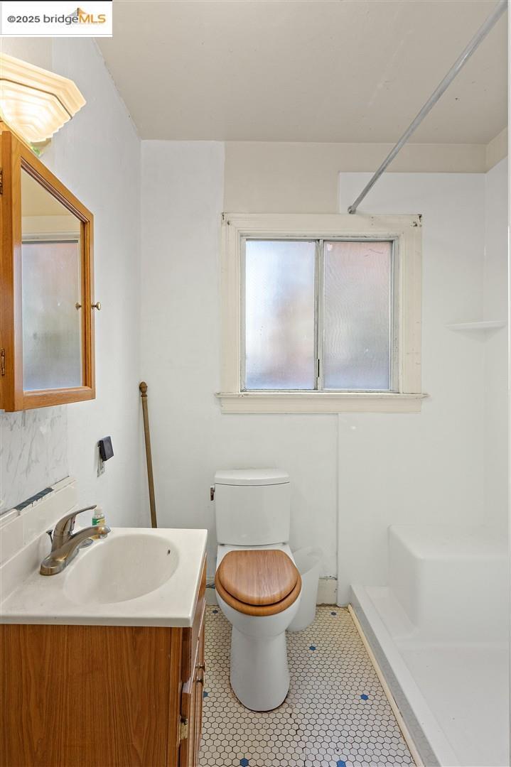 2201-2203 Spaulding Avenue Berkeley, CA 94703 - Photo 49 of 56 Full bathroom featuring a shower stall, vanity, and tile patterned flooring
