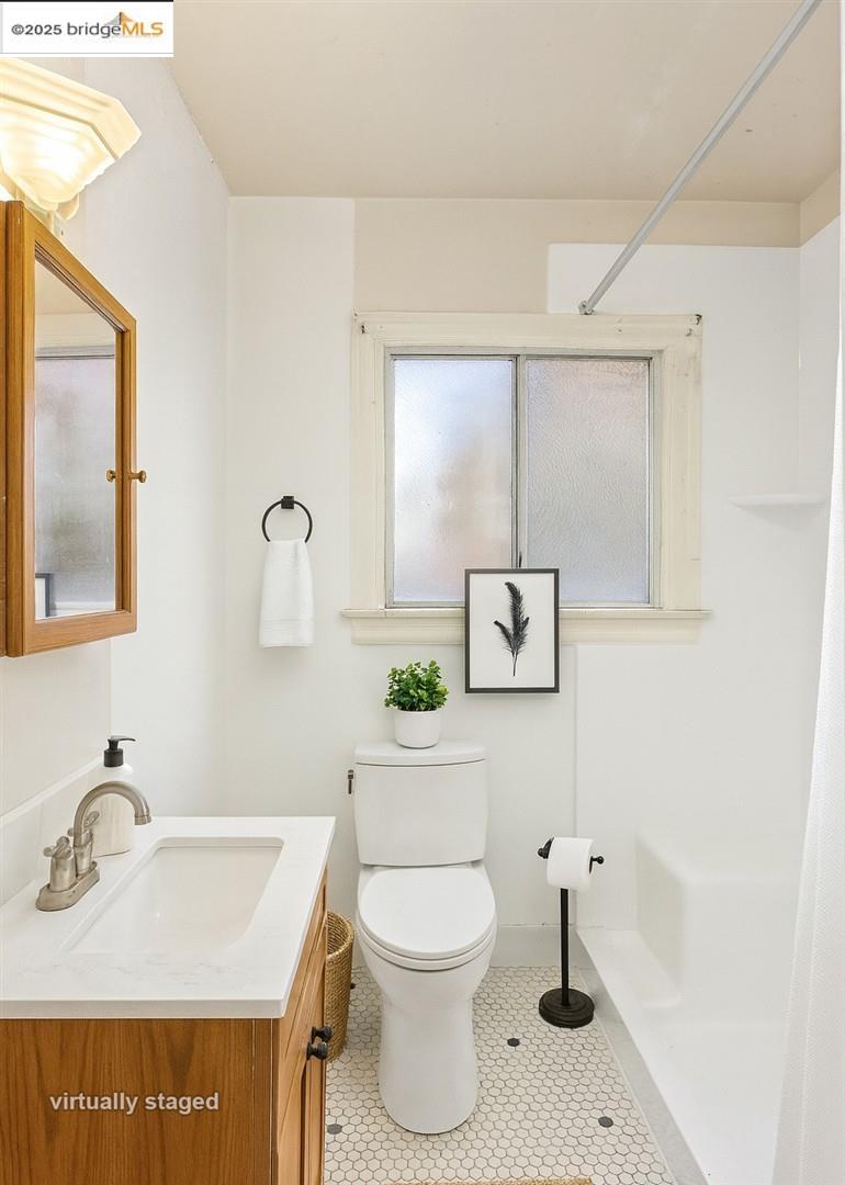 2201-2203 Spaulding Avenue Berkeley, CA 94703 - Photo 50 of 56 Bathroom featuring vanity, a shower with shower curtain, and light tile patterned floors