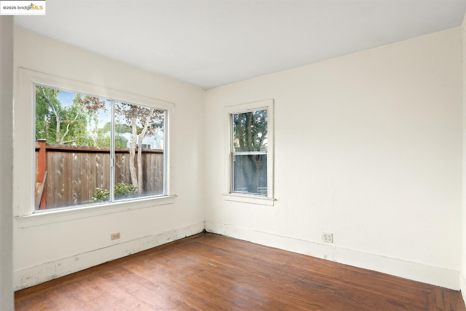 2201-2203 Spaulding Avenue Berkeley, CA 94703 - Photo 51 of 56 Spare room featuring wood finished floors and baseboards