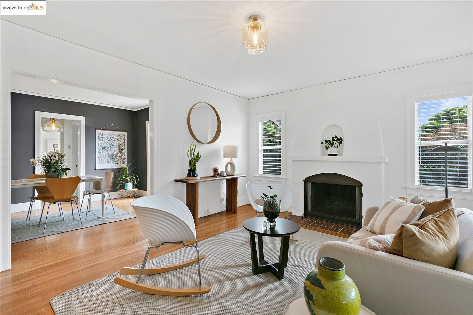 2201-2203 Spaulding Avenue Berkeley, CA 94703 - Photo 8 of 56 Living room with wood finished floors, plenty of natural light, and a fireplace with flush hearth