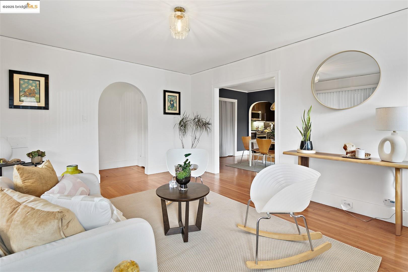 2201-2203 Spaulding Avenue Berkeley, CA 94703 - Photo 10 of 56 Living area with arched walkways and wood finished floors