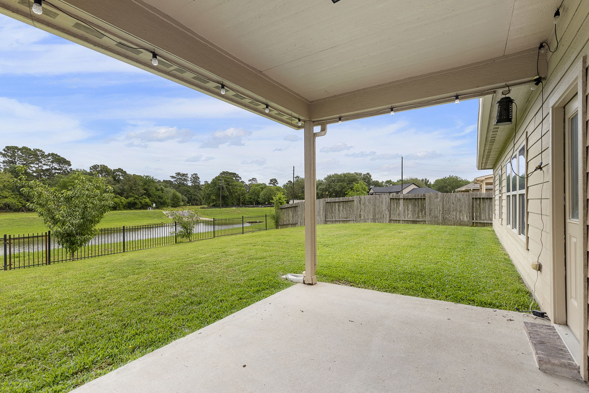 22810 Dale River Road Tomball, TX 77375 - Photo 31 of 44 Covered back porch is a great space to relax and enjoy your water and nature views.