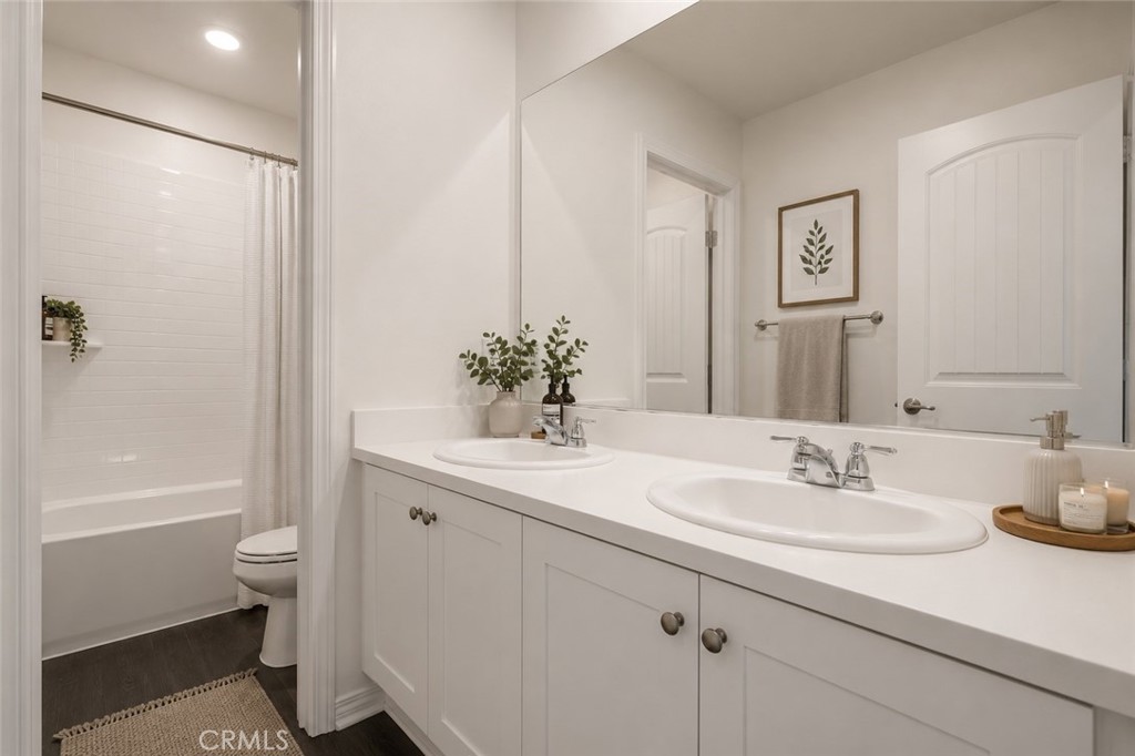 11056 Guffey Ranch Way Corona, CA 92883 - Photo 33 of 61 a bathroom with a sink a toilet and shower