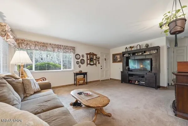 a kitchen with stainless steel appliances granite countertop a refrigerator sink and stove