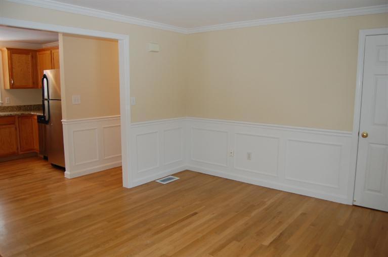 142 Skunknet Road Centerville, MA 02632 - Photo 14 of 35 an empty room with wooden floor and entrance