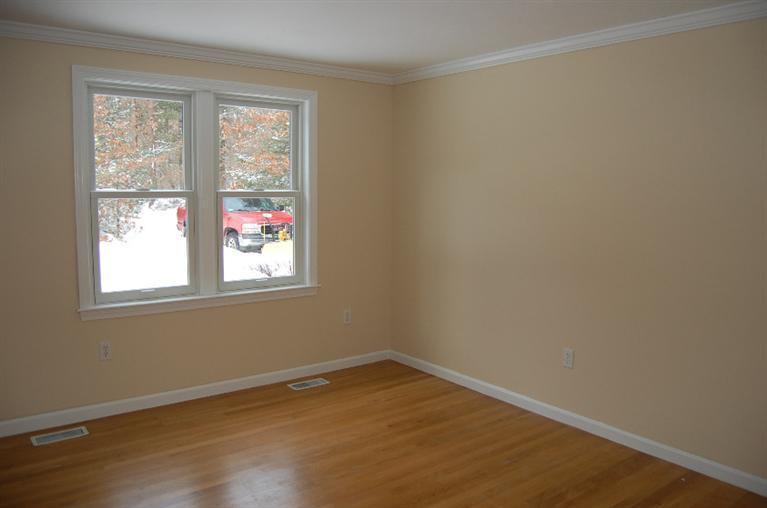 142 Skunknet Road Centerville, MA 02632 - Photo 15 of 35 an empty room with wooden floor and windows