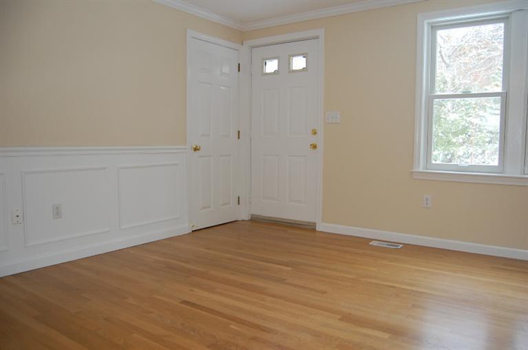 142 Skunknet Road Centerville, MA 02632 - Photo 16 of 35 a view of an empty room with wooden floor and a window