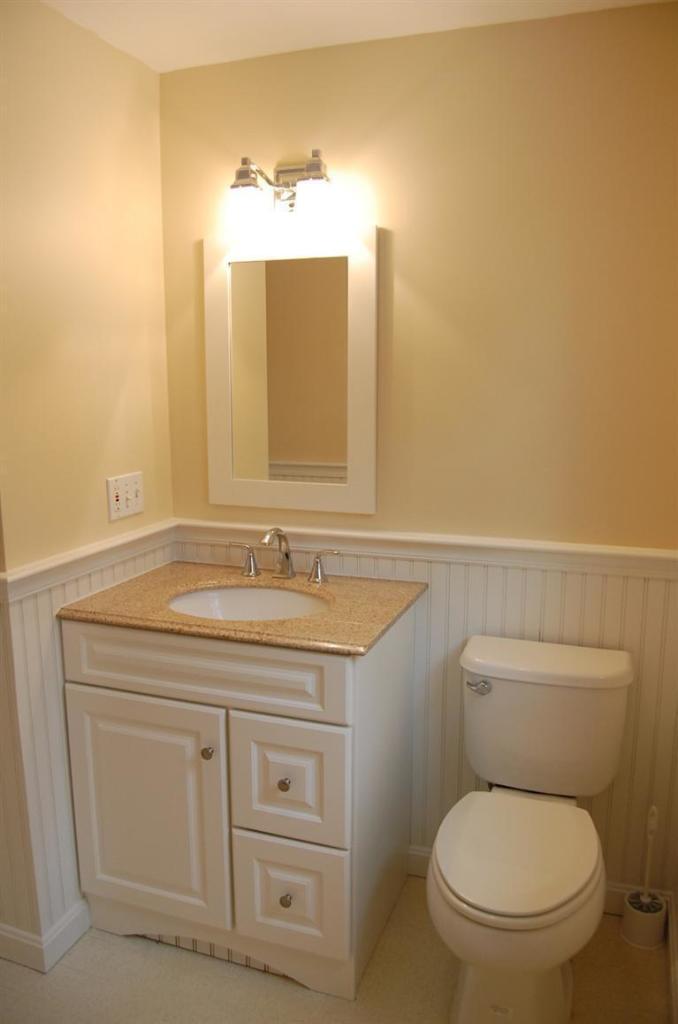 142 Skunknet Road Centerville, MA 02632 - Photo 19 of 35 a bathroom with a granite countertop toilet sink and mirror