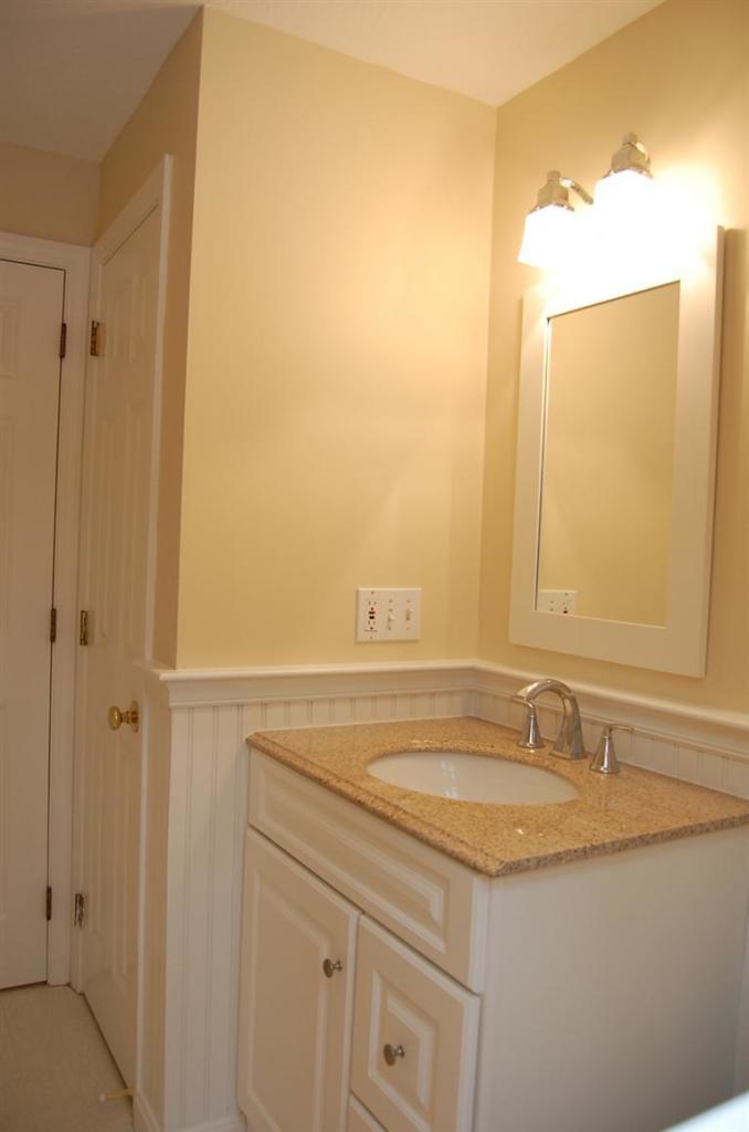 142 Skunknet Road Centerville, MA 02632 - Photo 21 of 35 a bathroom with a granite countertop sink and a mirror