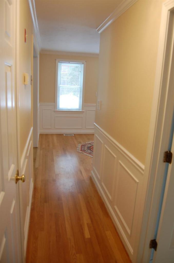 142 Skunknet Road Centerville, MA 02632 - Photo 24 of 35 a view of an empty room with wooden floor and a window