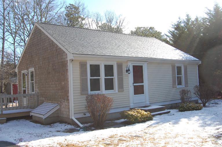 142 Skunknet Road Centerville, MA 02632 - Photo 30 of 35 a front view of a house with a yard