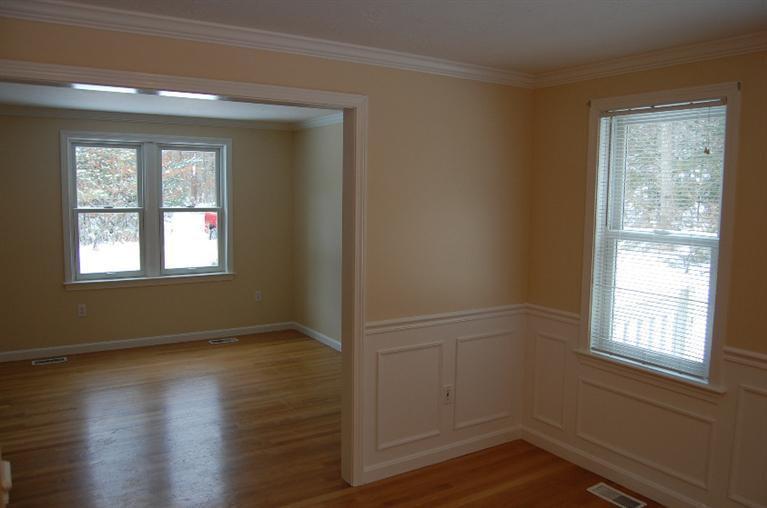 142 Skunknet Road Centerville, MA 02632 - Photo 5 of 35 a view of an empty room with wooden floor and a window