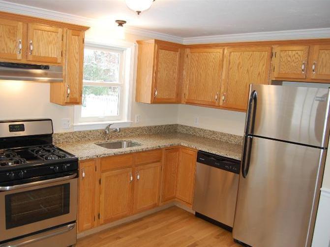 142 Skunknet Road Centerville, MA 02632 - Photo 7 of 35 a kitchen with a refrigerator stove and sink