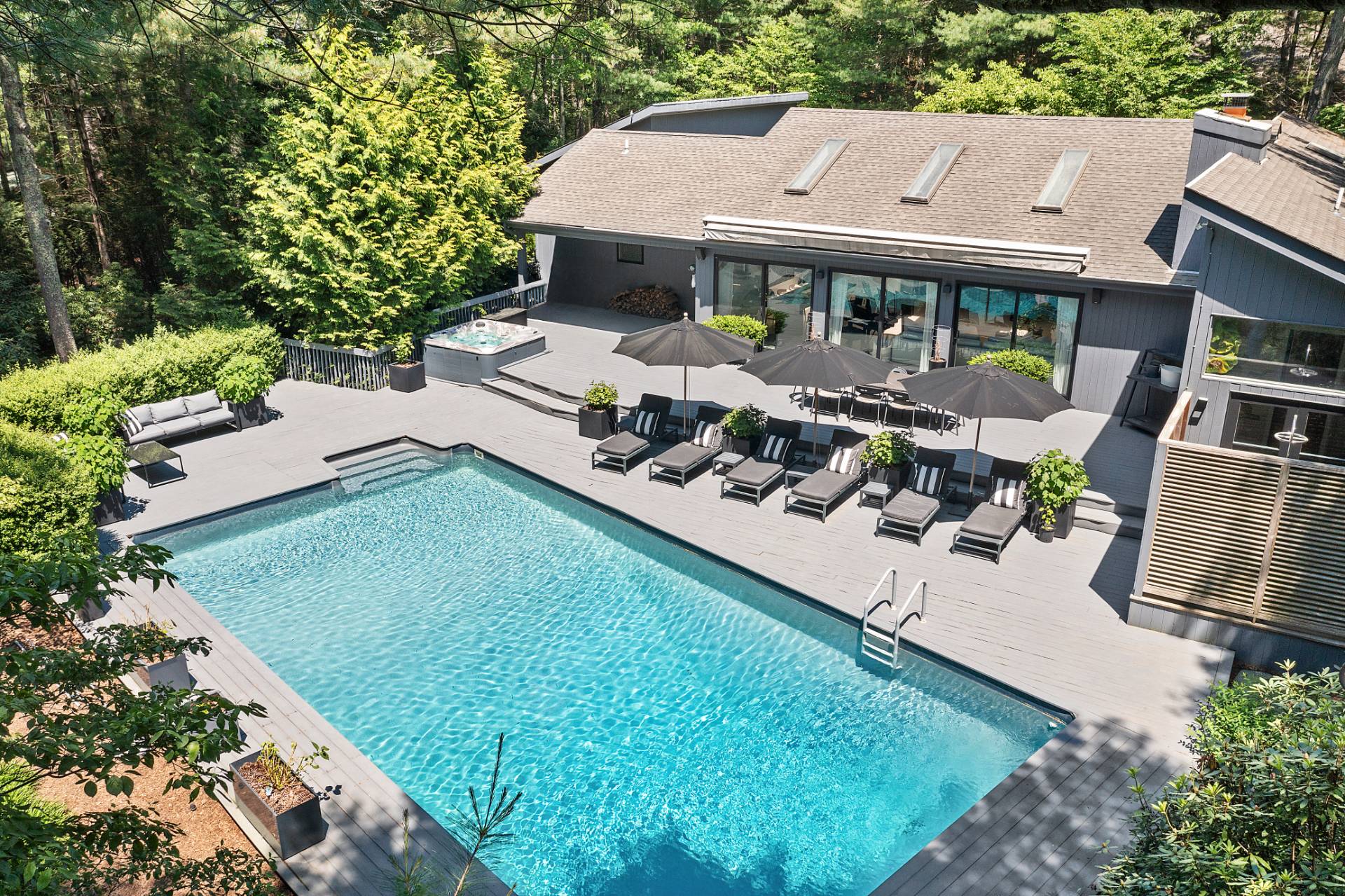 4 Bull Path Close East Hampton, NY 11937 - Photo 1 of 38 an aerial view of a house with garden space and patio