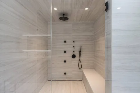 a bathroom with a bathtub and shower