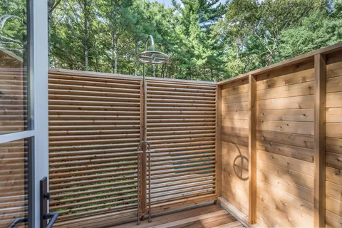 a view of a back yard from a balcony