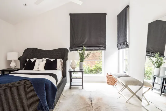 a bed room with a bed and a television