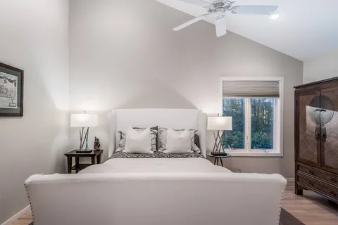 a bedroom with a bed and a tv