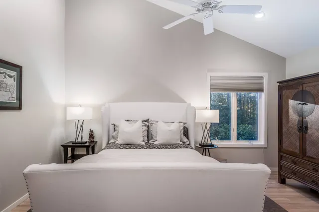 a bedroom with a bed and a tv