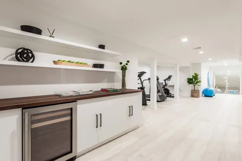 a kitchen with stainless steel appliances a sink a stove and cabinets