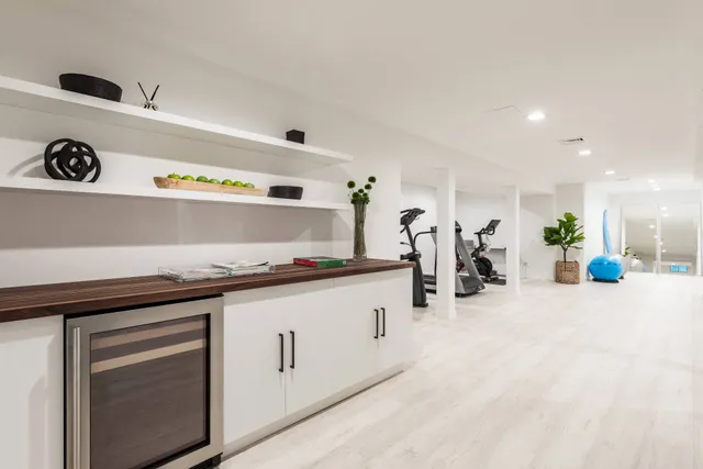a kitchen with stainless steel appliances a sink a stove and cabinets