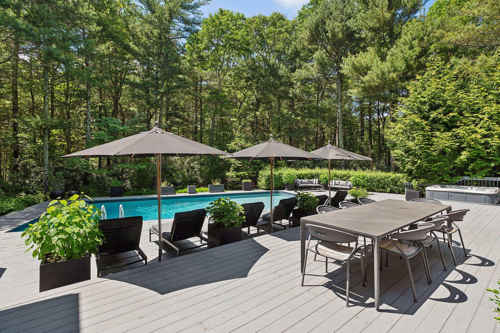 4 Bull Path Close East Hampton, NY 11937 - Photo 32 of 38 an outdoor space with patio table and chairs