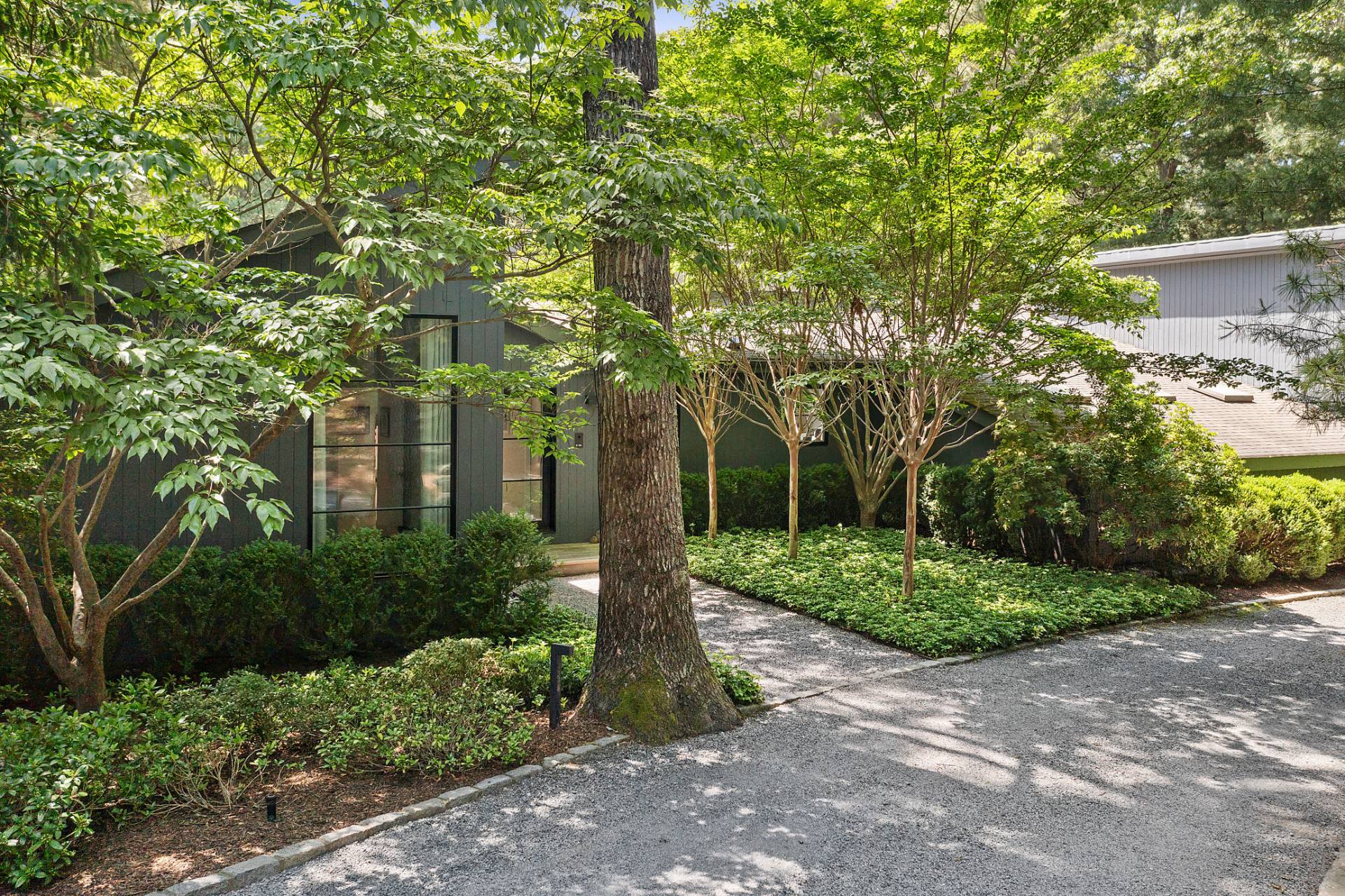 4 Bull Path Close East Hampton, NY 11937 - Photo 5 of 38 a front view of a house with a yard