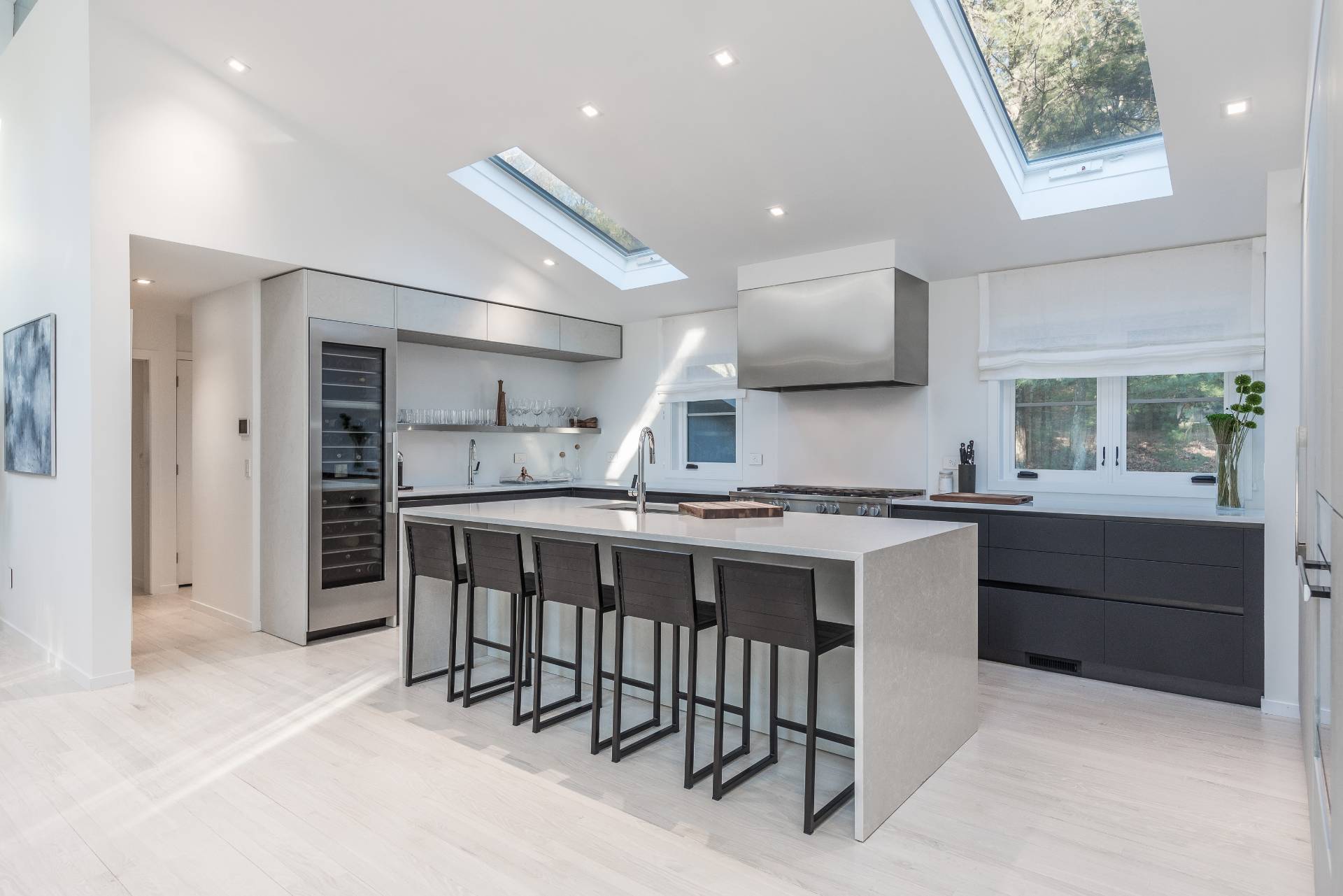 4 Bull Path Close East Hampton, NY 11937 - Photo 10 of 38 a kitchen with a sink and chairs