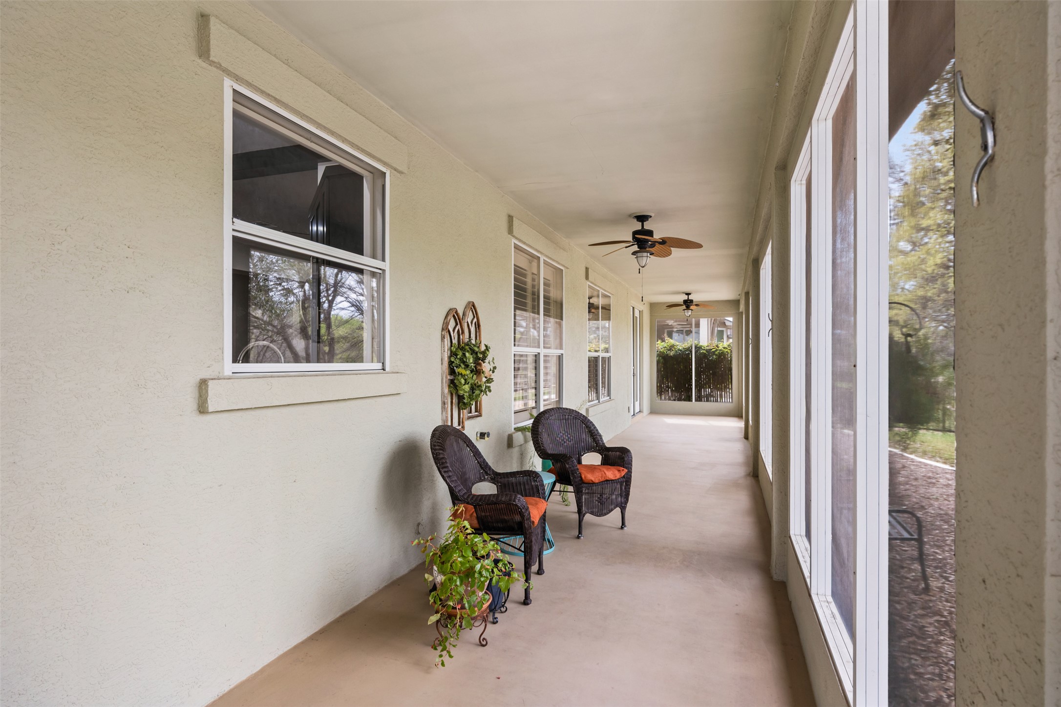 144 Stetson Trail Georgetown, TX 78633 - Photo 32 of 39 Screened-in sunroom with ceiling fan and beautiful view