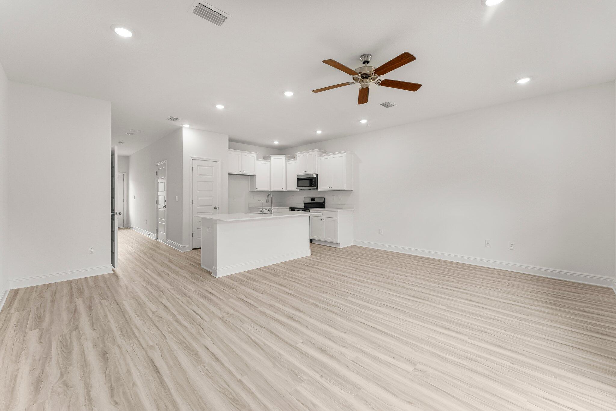 48 Hawk Street Santa Rosa Beach, FL 32459 - Photo 17 of 34 a view of a kitchen with a sink and a refrigerator