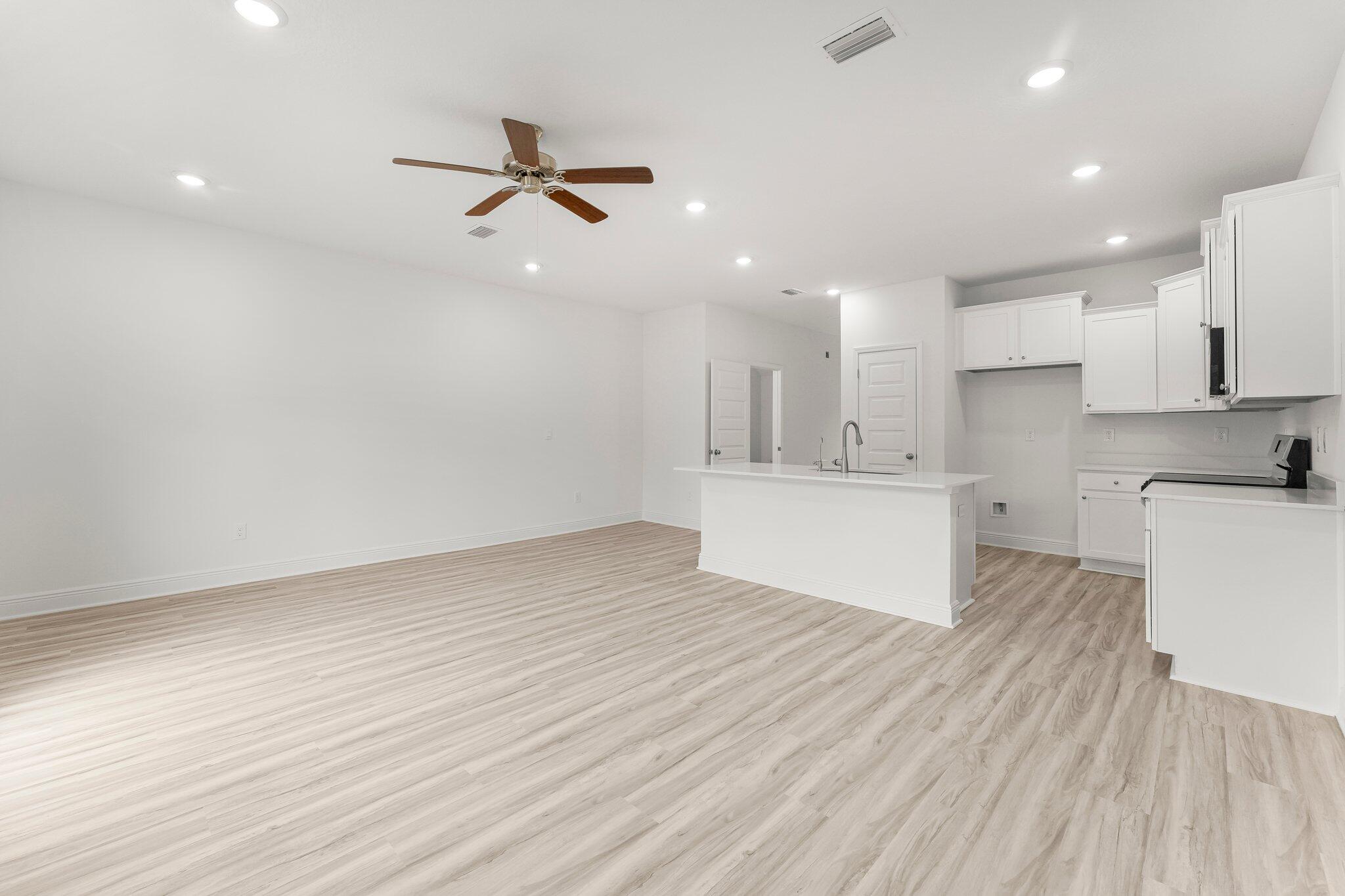 48 Hawk Street Santa Rosa Beach, FL 32459 - Photo 18 of 34 a view of a kitchen with wooden floor and a sink