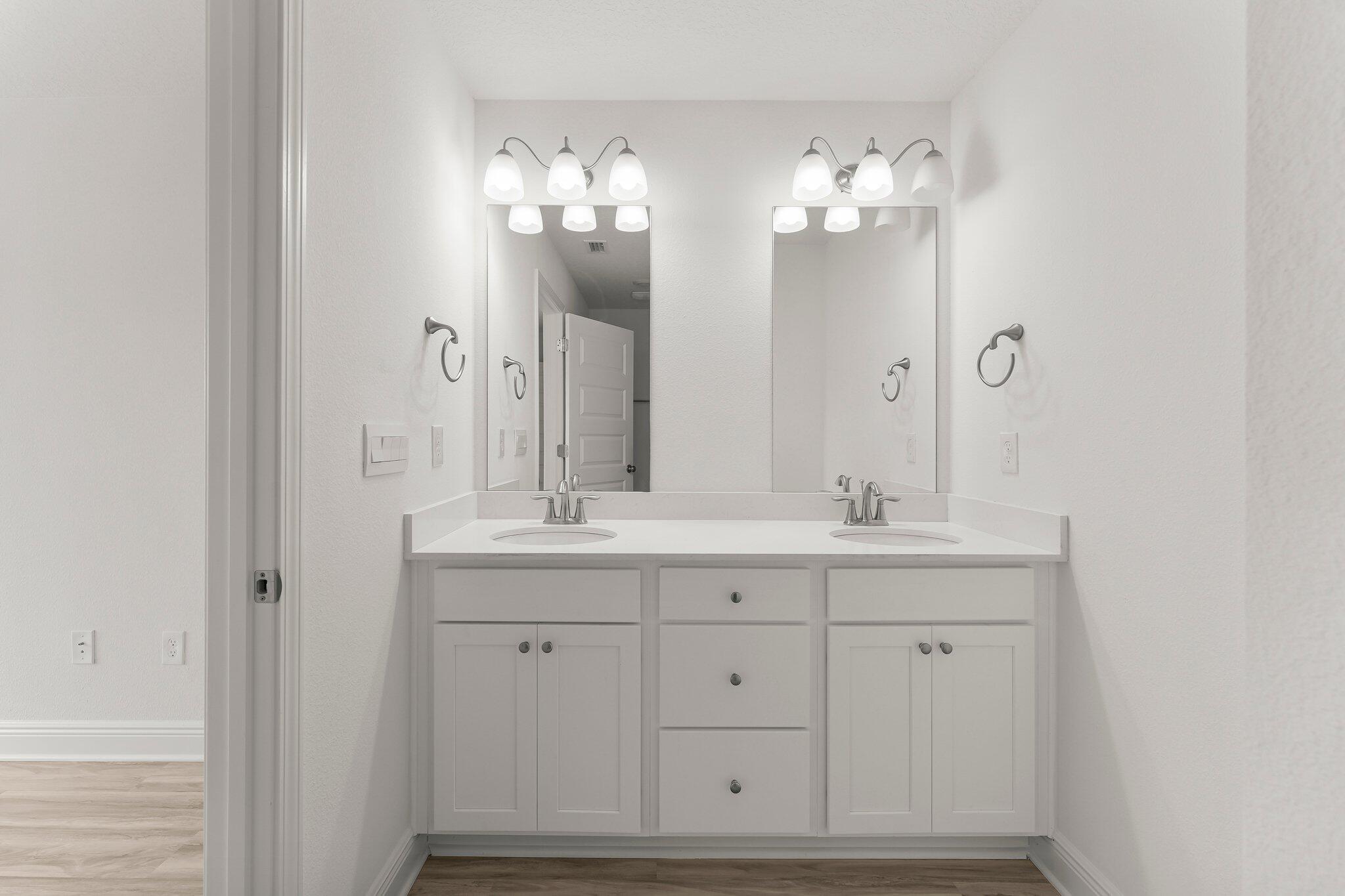 48 Hawk Street Santa Rosa Beach, FL 32459 - Photo 23 of 34 a bathroom with a sink and a mirror